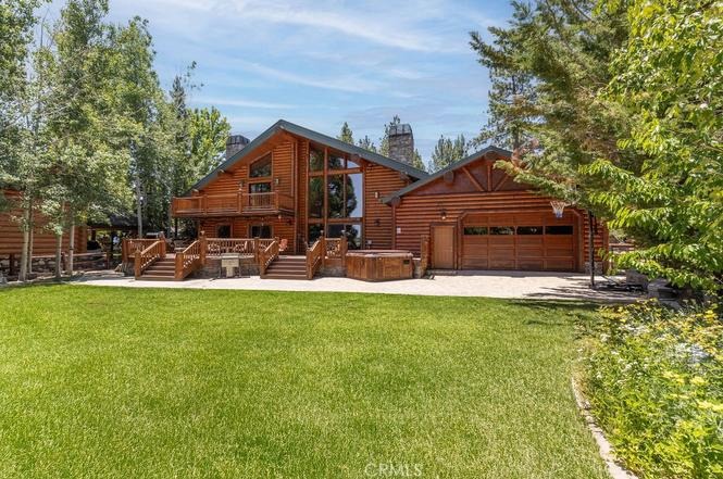 Lodge exterior and landscaped lawn at the Big Bear Lake house rental