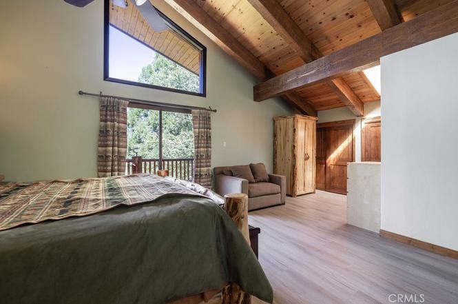 Master suite with lake views through large windows